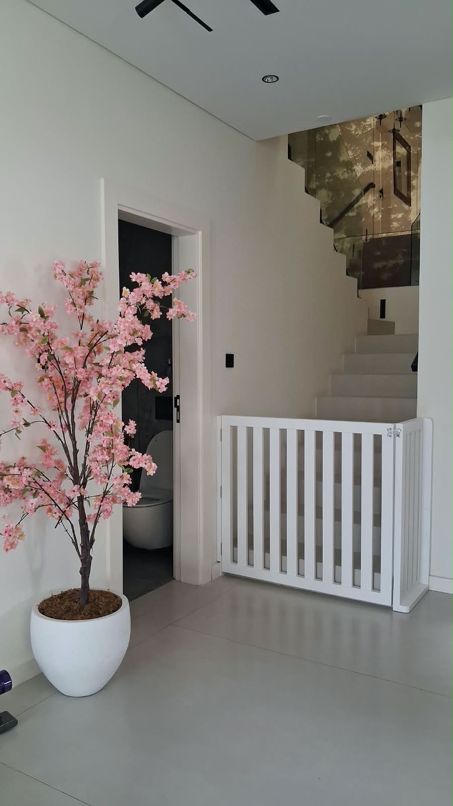 Staircase after a white safety gate was fitted